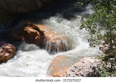 A Swift River With Huge Rocks 