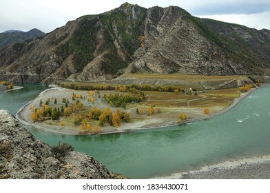 A Swift, Turbulent Turquoise River Flows Through An Autumn Valley Surrounded By Mountain Peaks. Katun, Altai, Siberia, Russia.