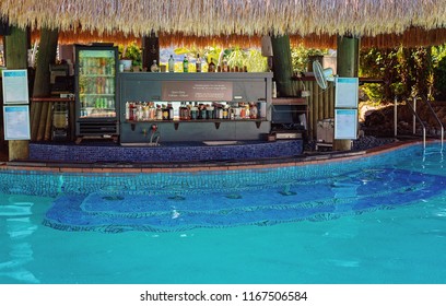 A Swim Up Cocktail Bar In The Middle Of A Pool On A Luxury Island Resort