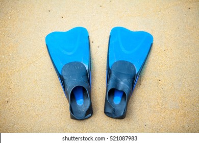 Swim Flippers On A Sand Beach