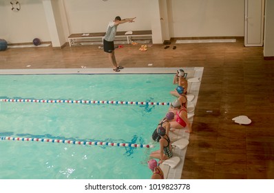 Swim Trainer Educate Child On Swimming Pool Indoor.Swiming Kid School.