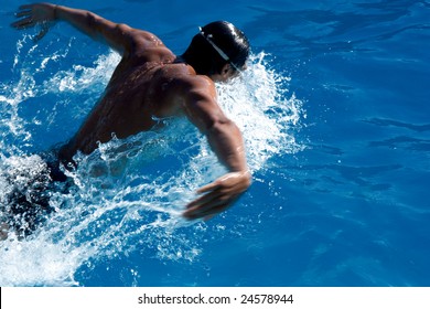 Swimmer in blue water. Motion blur.