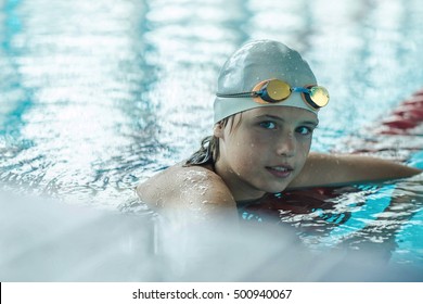 Swimmer Child. Portrait Of Swimming Child Athlete In Glasses After Training In Waterpool.