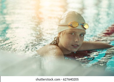 Swimmer Child. Portrait Of Swimming Child Athlete With Goggles After Training In Waterpool.