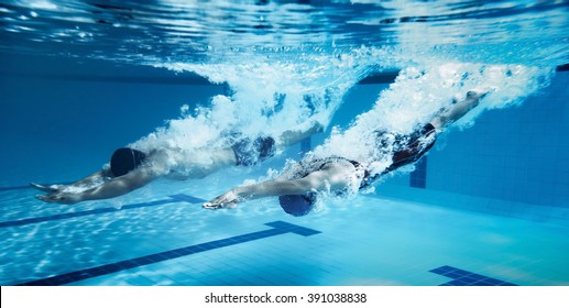swimmer  Jump from platform jumping A swimming pool.Underwater photo