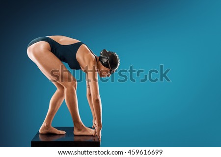 swimmer on the Studio prepares to jump