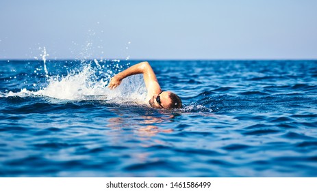 Swimmer Training On The Open Sea / Ocean.