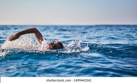 Swimmer Training On The Open Sea / Ocean.