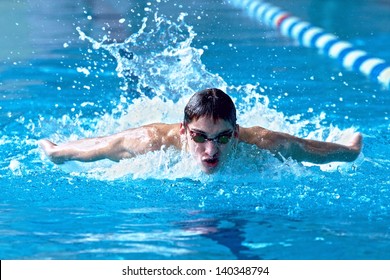 Swimmer in waterpool swim one of swimming style - Powered by Shutterstock