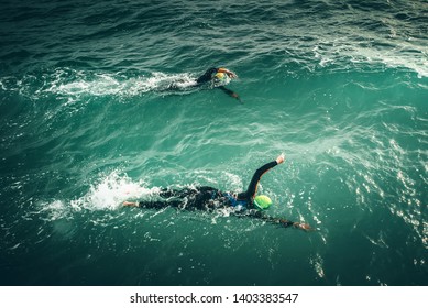 Swimmers Swim During Swimming Competition In The Sea. Open Water Sport Race