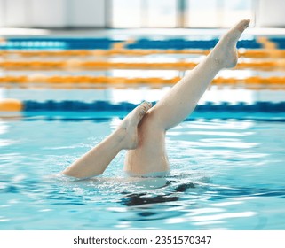 Swimming, athlete and legs in water upside down, exercise and training for healthy body. Pool, feet and person alone in synchronized workout, sport art and practice for fitness in wellness underwater - Powered by Shutterstock