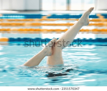 Swimming, athlete and legs in water upside down, exercise and training for healthy body. Pool, feet and person alone in synchronized workout, sport art and practice for fitness in wellness underwater