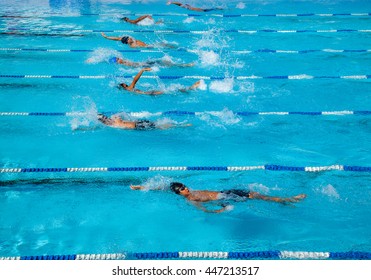 swimming backstroke in a race. - Powered by Shutterstock