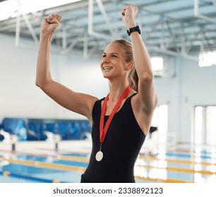 Swimming, competition and winner in celebration with medal, achievement or happiness from success in the race or pool. Winning, championship and woman swimmer or athlete on sports podium with gold - Powered by Shutterstock