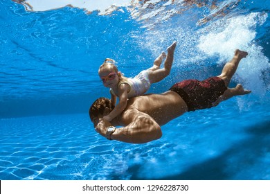 Swimming family, father and child in water, pool
 - Powered by Shutterstock