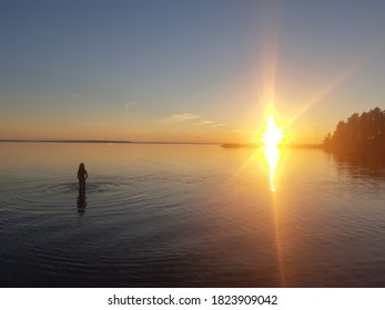 Swimming Finnish Girl On Midnight Sun