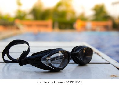 Swimming Glasses On The Table Near The Pool