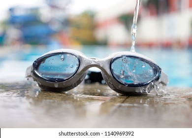 swimming goggles near the pool - Shutterstock ID 1140969392