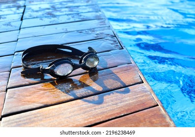 Swimming Goggles Near The Pool. High Quality Photo