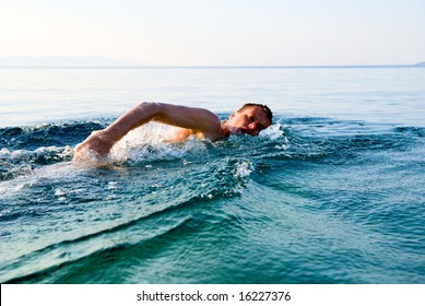 Swimming Man In Clean Ocean Water