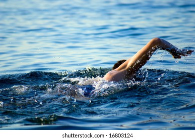 Swimming Man In Ocean Water