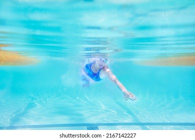 Swimming To A Personal Best. Underwater Shot Of A Female Swimmer.