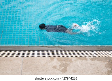 Swimming in the pool.