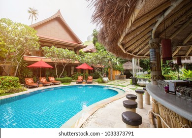 Swimming Pool Area With Bar In Luxury Hotel Resort. Hot Summer Day, Holiday And Travel In Asia