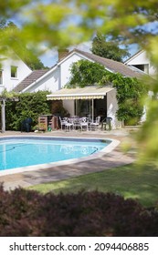 Swimming Pool In Backyard Of House