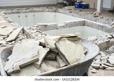 Swimming Pool Being Demolished With Jack Hammer For Remodel And New Tile And Coping And Plaster