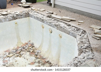 Swimming Pool Being Demolished With Jack Hammer For Remodel And New Tile And Coping And Plaster