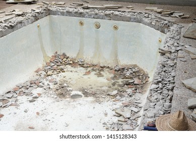 Swimming Pool Being Demolished With Jack Hammer For Remodel And New Tile And Coping And Plaster