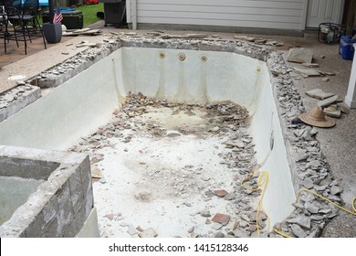 Swimming Pool Being Demolished With Jack Hammer For Remodel And New Tile And Coping And Plaster