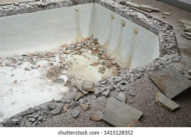 Swimming Pool Being Demolished With Jack Hammer For Remodel And New Tile And Coping And Plaster