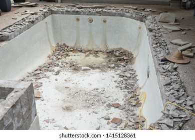 Swimming Pool Being Demolished With Jack Hammer For Remodel And New Tile And Coping And Plaster