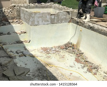 Swimming Pool Being Demolished With Jack Hammer For Remodel And New Tile And Coping And Plaster