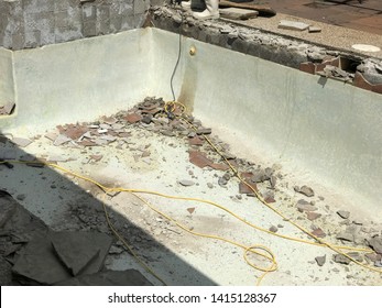 Swimming Pool Being Demolished With Jack Hammer For Remodel And New Tile And Coping And Plaster