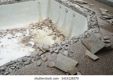 Swimming Pool Being Demolished With Jack Hammer For Remodel And New Tile And Coping And Plaster