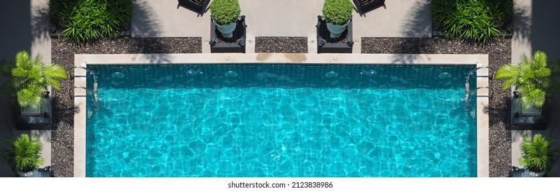Swimming pool blue water in summer top view angle. Aerial view images of swimming pool in a sunny day which suitable for sport or relax on vacation time or workout for burn some calories in holiday. - Shutterstock ID 2123838986
