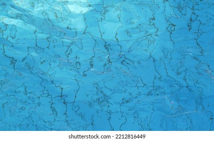 Swimming Pool Broken Water. Closeup Of Rough Water Texture. Abstract Texture That Can Be Used As A Background
