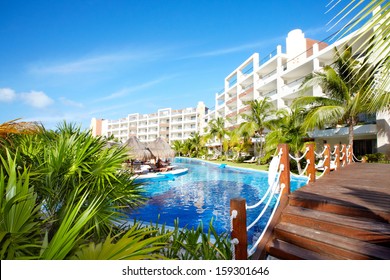 Swimming pool at caribbean resort. Exotic garden. - Shutterstock ID 159301646