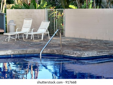 Swimming Pool With Chase Lounge Chairs