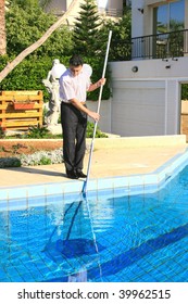 Swimming Pool Cleaner At  Work.