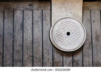 Swimming Pool Filter In A House With A Wooden Cover