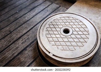 Swimming Pool Filter In A House With A Wooden Cover