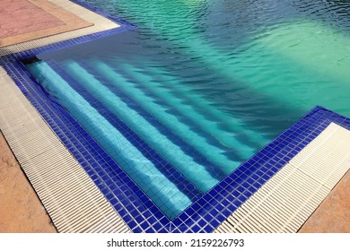 Swimming pool with green stagnant algae filled water before cleaning