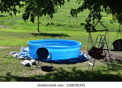 Swimming Pool And Lawn Furniture In A Yard