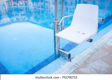 Swimming Pool Lift For Disabled People Access To The Pool. Holidays Resort Background