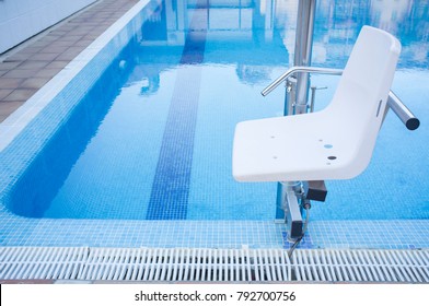 Swimming Pool Lift For Disabled People Access To The Pool. Holidays Resort Background