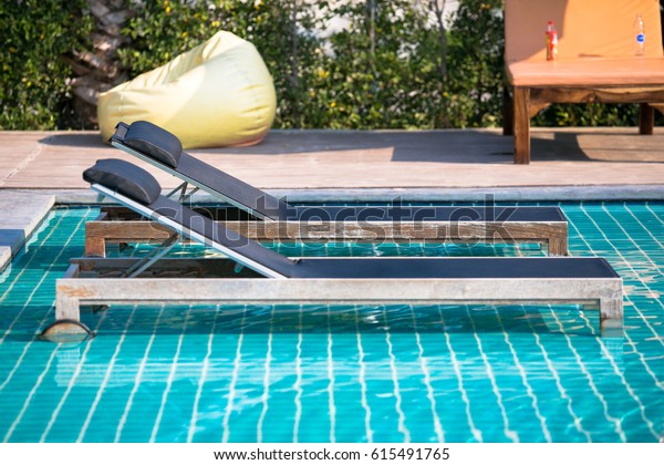 Swimming Pool Lounge Chairs Umbrellas On Stock Photo Edit Now